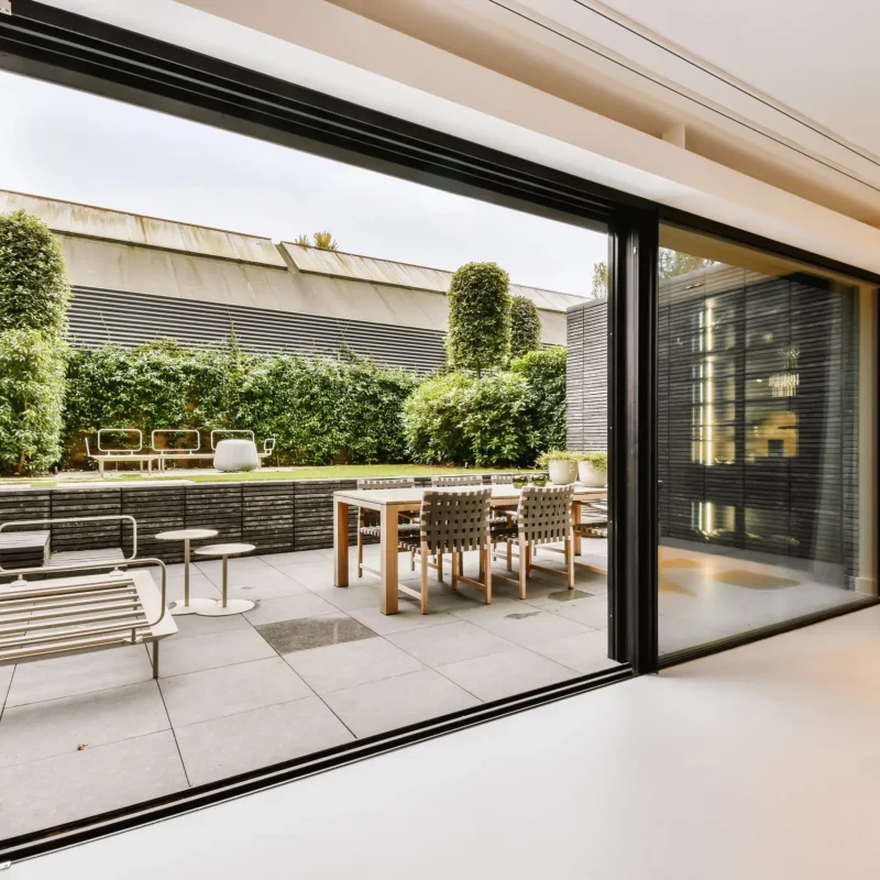 Attractive huge sliding glass door leading to the courtyard