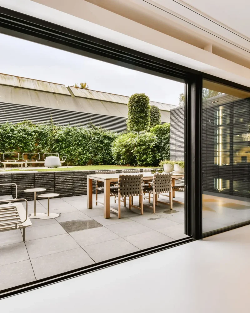 Attractive huge sliding glass door leading to the courtyard
